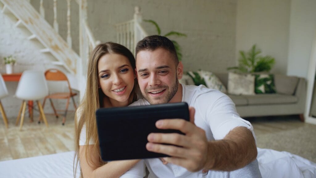 Couple taking a selfie with a tablet